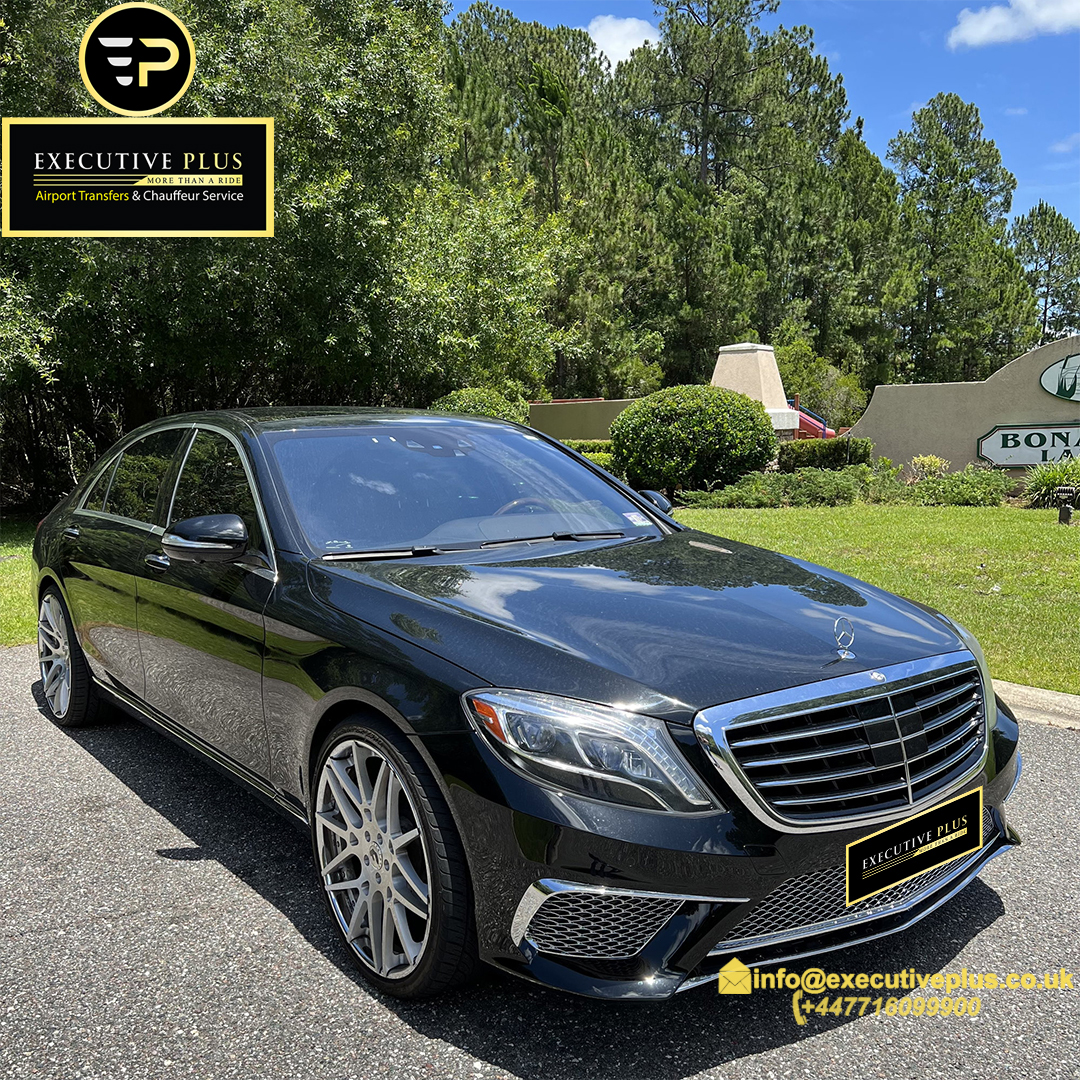 Business Transfer is the main purpose of The black Mercedes S-Class is parked in the woods waiting for clients of Executive Plus Airport Transfers